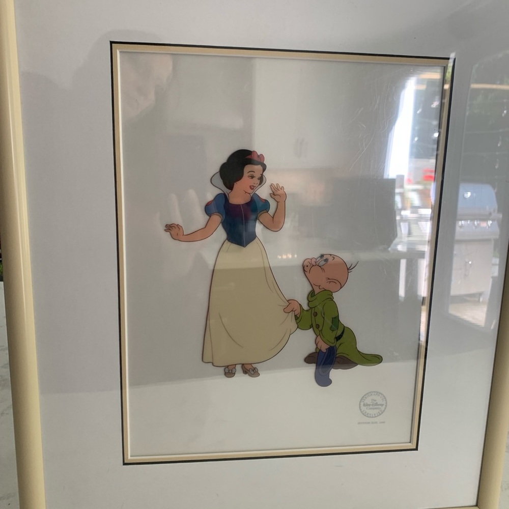 Original framed Disney cerigraph cell of Snow White and Dopey.